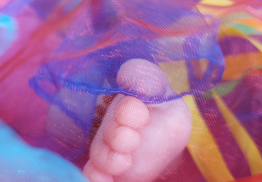baby foot in coloured organza sensory scarf
