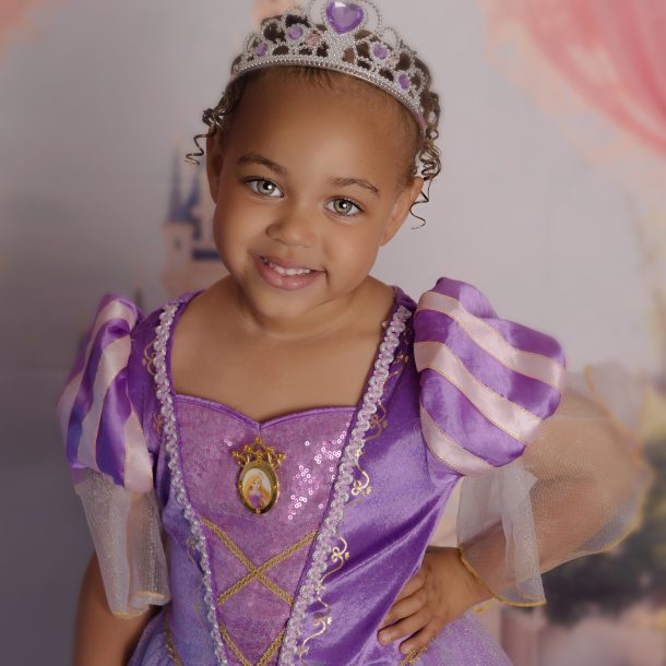 3 year old girl wearing purple princess dress