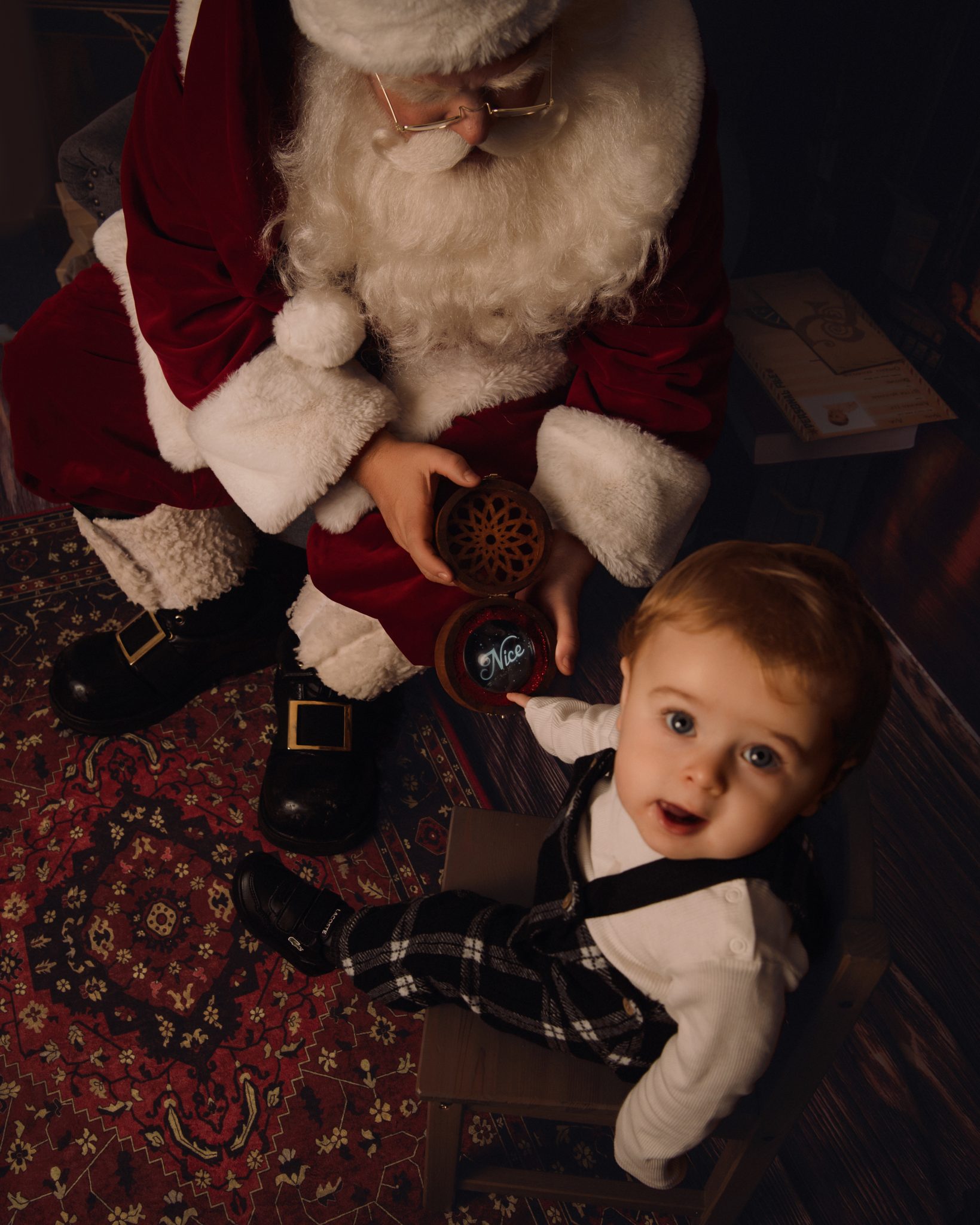 baby boy at his santa experience at photography studio in cambridgeshire